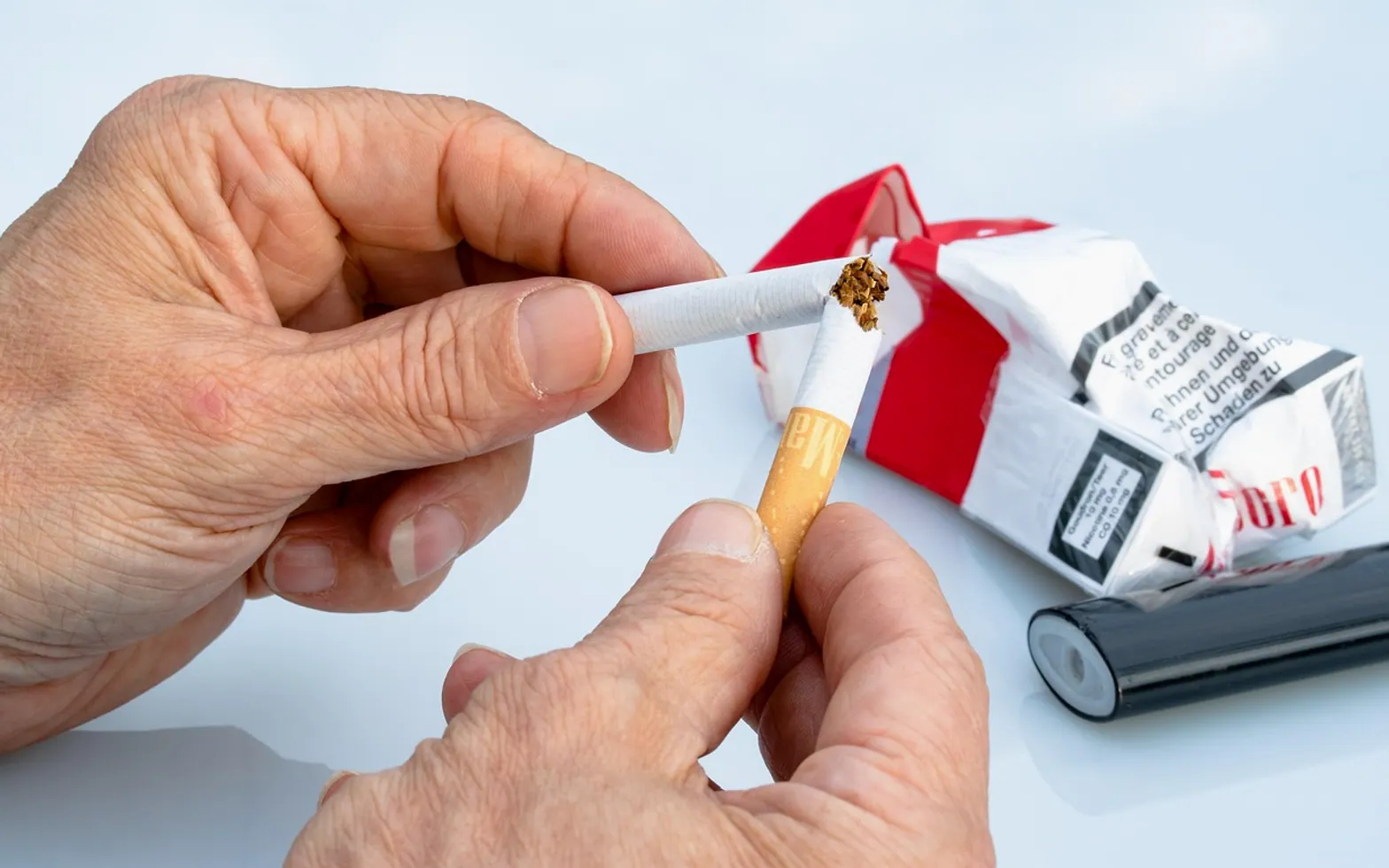Non-smoker, cigarette and hands